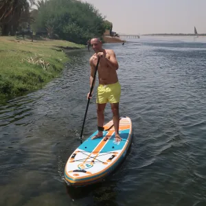 Paddler on a green branch of the Nile